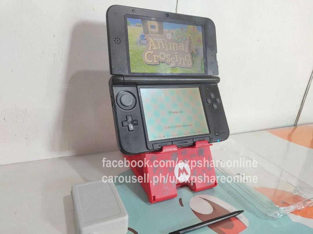 Nintendo 3DSXL 16GB With Games (Category: Nintendo) located in Cebu City. Submitted by expshareonline (Listing ID 1465964056, Image 2). Description: - Nintendo 3DS XL handheld console in blue - 16GB storage capacity with popular pre-installed games (Pokémon, Animal Crossing, Mario Kart, Zelda) - Dual screens in working condition - Includes original charger, stylus, and protective clear case - Ready to use for gaming enthusiasts.