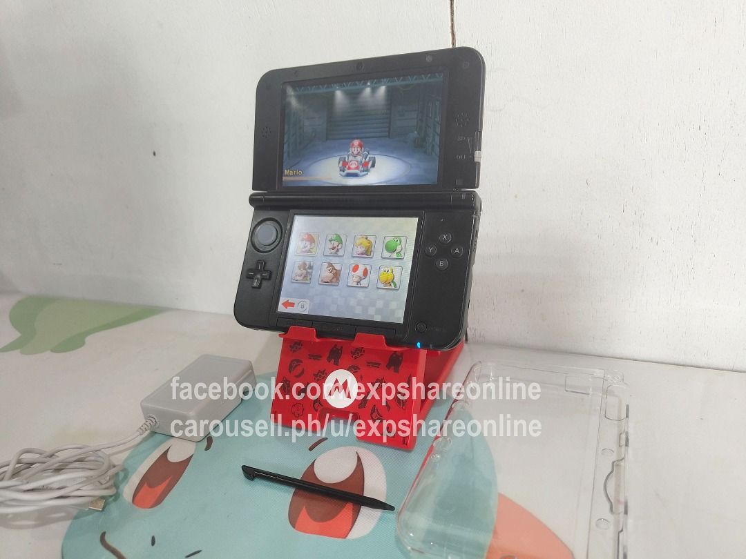 Nintendo 3DSXL 16GB With Games (Category: Nintendo) located in Cebu City. Submitted by expshareonline (Listing ID 1465964056, Image 3). Description: - Nintendo 3DS XL handheld console in blue - 16GB storage capacity with popular pre-installed games (Pokémon, Animal Crossing, Mario Kart, Zelda) - Dual screens in working condition - Includes original charger, stylus, and protective clear case - Ready to use for gaming enthusiasts.