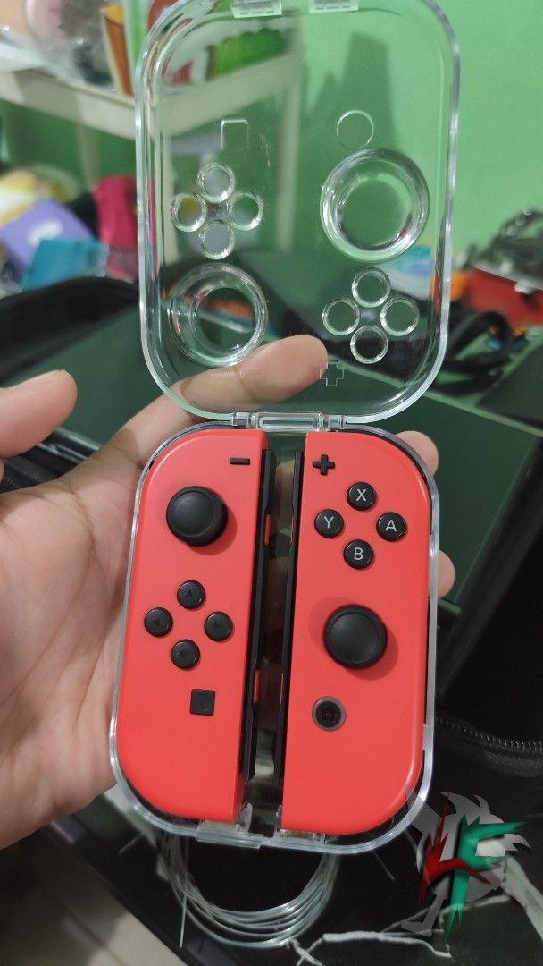 Nintendo Switch JOYCON "Mario Red Edition" (Authentic) (Category: Nintendo) located in Taguig. Submitted by love.figures.toy.shop (Listing ID 1466037635, Image 1). Description: Nintendo Switch Joycon Super Mario Red Limited Edition Authentic Nintendo Product No Issue, Good Condition With Free Travel Case.