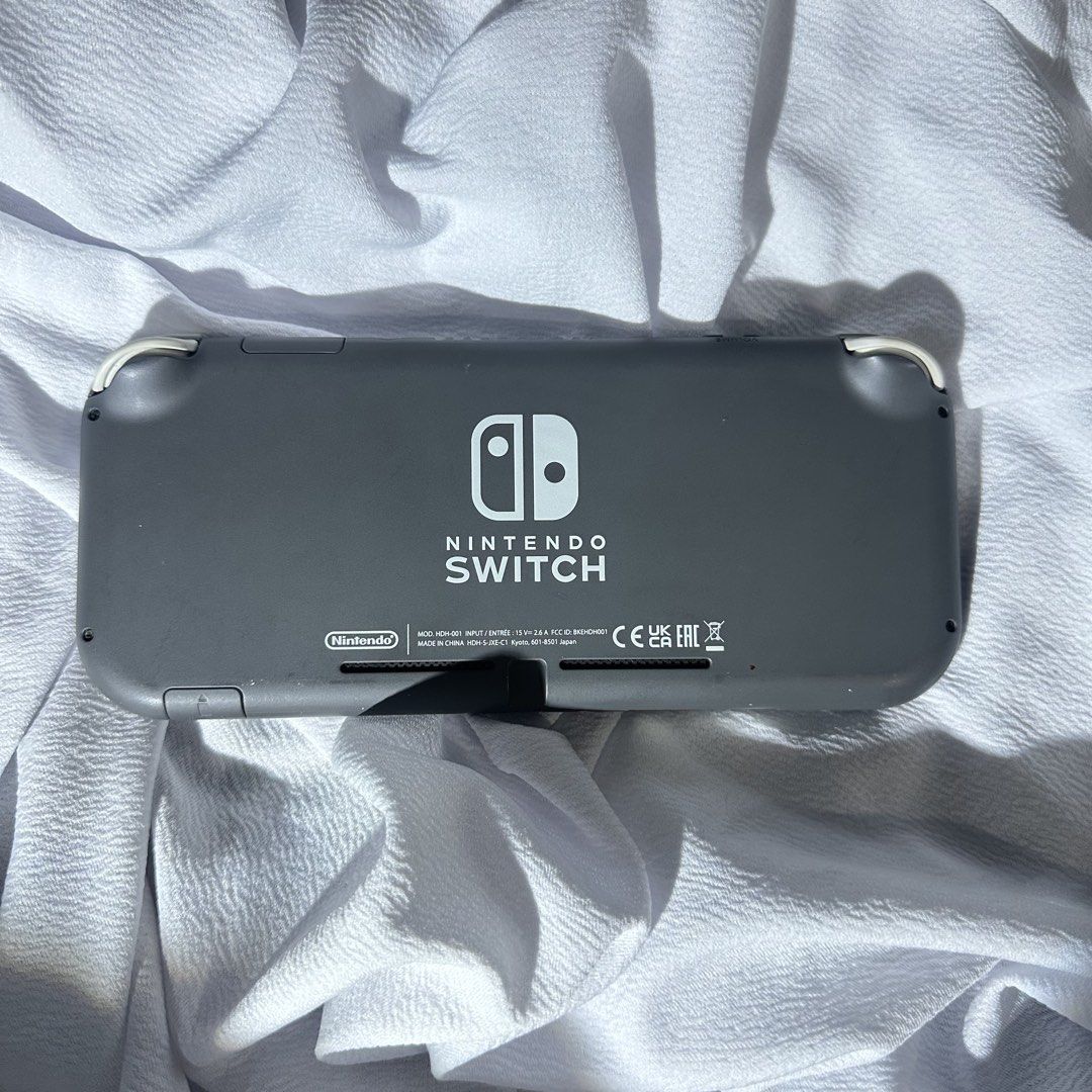 Nintendo Switch Lite Gray (Category: Other Gadgets) located in Caloocan City. Submitted by eightyflip (Listing ID 1466122586, Image 2). Description: Nintendo Switch Lite Gray Jailbreak Unit • With SanDisk 128GB SD Card • Comes with multiple games • Jailbreak unit. Can’t connect to wifi. Good for offline games • Unit only (Still have the OG charger but it’s in Marikina. Can provide details for Lalamove if buyer wants to include the charger as well