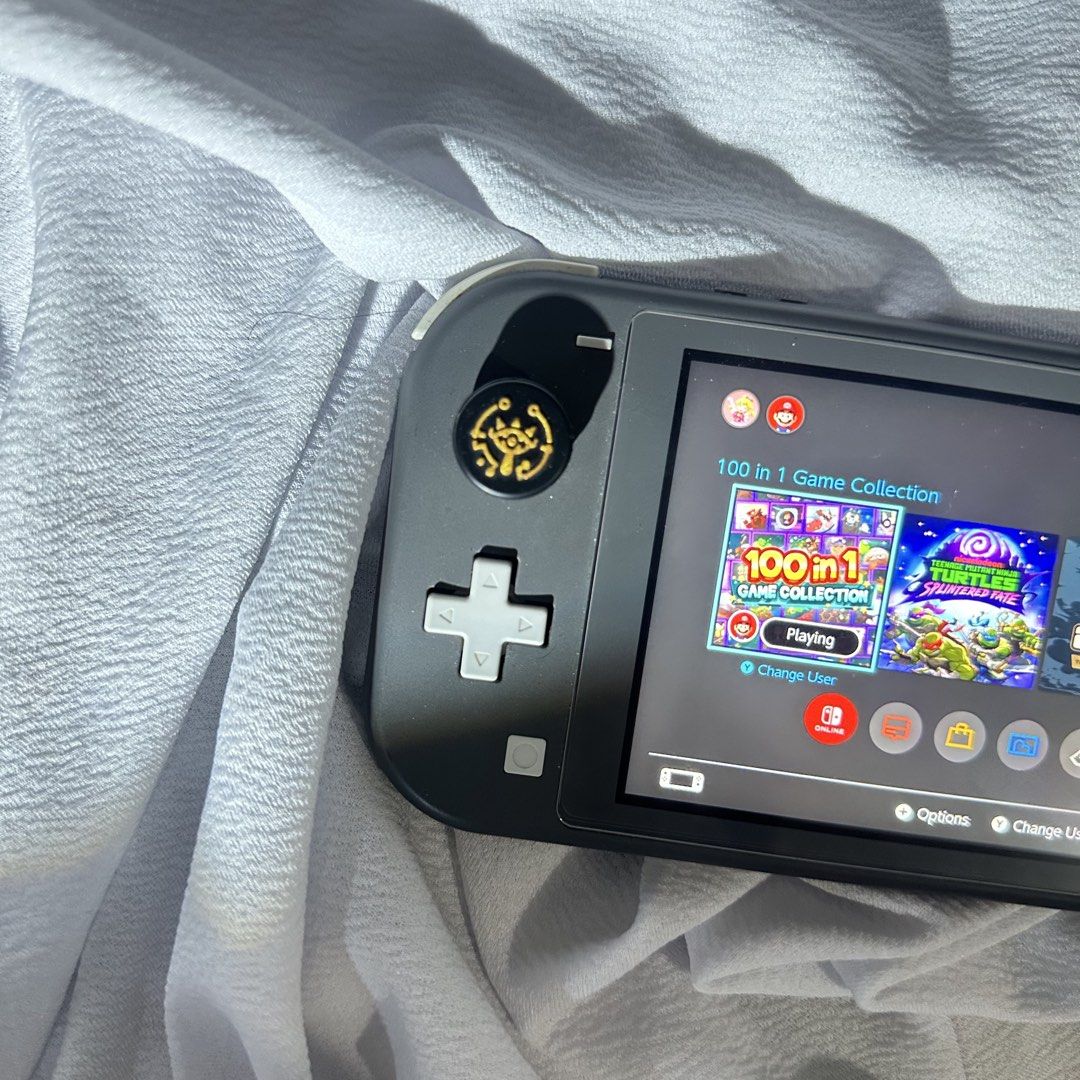 Nintendo Switch Lite Gray (Category: Other Gadgets) located in Caloocan City. Submitted by eightyflip (Listing ID 1466122586, Image 3). Description: Nintendo Switch Lite Gray Jailbreak Unit • With SanDisk 128GB SD Card • Comes with multiple games • Jailbreak unit. Can’t connect to wifi. Good for offline games • Unit only (Still have the OG charger but it’s in Marikina. Can provide details for Lalamove if buyer wants to include the charger as well