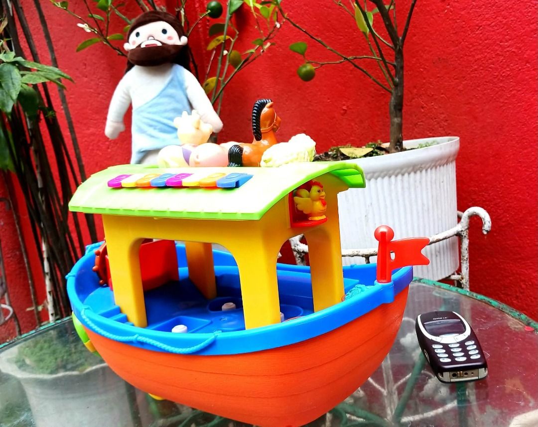 NOAH'S ARK w/ Animal Figures & Xylophone (Working) (Category: Vintage Collectibles) located in Manila. Submitted by mickey_salonga (Listing ID 1466046155, Image 2). Description: - Vibrant toddler toy boat in bright orange, blue, and yellow with a green roof - Features a built-in xylophone with colorful keys on the roof for musical play - Includes animal figurines (sheep, horse, pig, cow) - Equipped with rolling wheels for fun push-along play - Gr