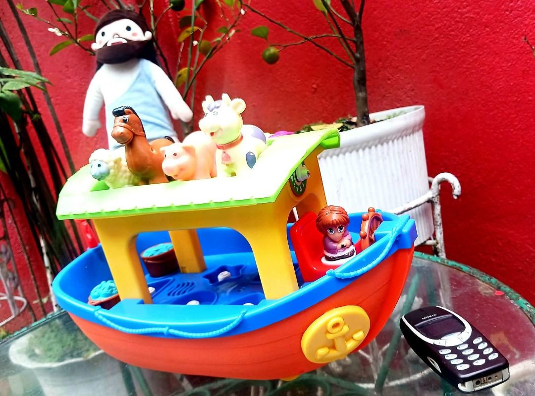 NOAH'S ARK w/ Animal Figures & Xylophone (Working) (Category: Vintage Collectibles) located in Manila. Submitted by mickey_salonga (Listing ID 1466046155, Image 3). Description: - Vibrant toddler toy boat in bright orange, blue, and yellow with a green roof - Features a built-in xylophone with colorful keys on the roof for musical play - Includes animal figurines (sheep, horse, pig, cow) - Equipped with rolling wheels for fun push-along play - Gr