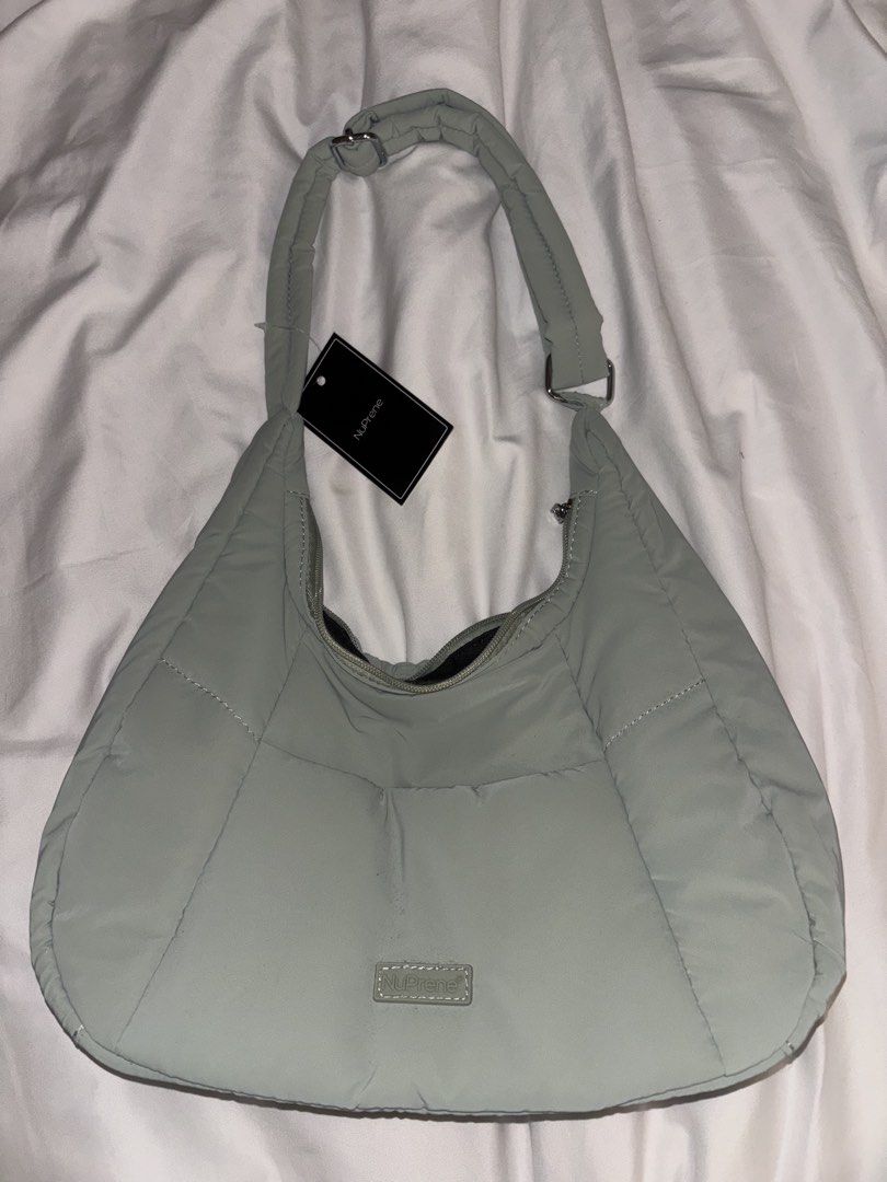NuPrene Puffer Bag (Category: Tote Bags) located in Muntinlupa City. Submitted by shigglegitter27 (Listing ID 1466135149, Image 1). Description: Brand new and never used (with tag) teal-gray NuPrene puffer bag!! Very cute and can fit many items; lightweight.
