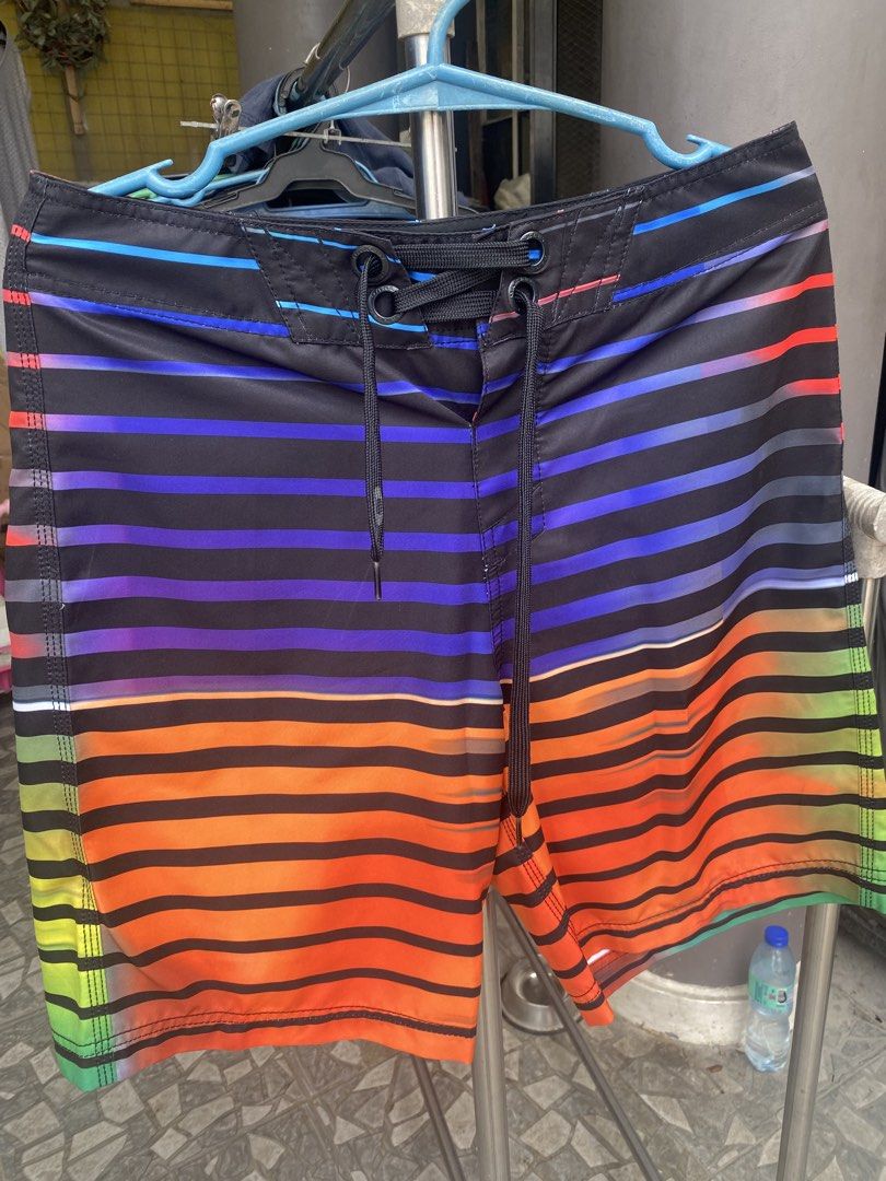Oakley Board Shorts Multi-Color Stripe Size 30 (Category: Swim Trunks & Board Shorts) located in San Jose del Monte. Submitted by gigjhoe (Listing ID 1465986570, Image 3). Description: - Brand: Oakley - Style: Board shorts with vibrant multi-color stripes (blue, purple, orange, green) on a black base - Size: 30 waist - Features: Lace-up front with black drawstrings, back pocket with button flap - Origin: Made in China.