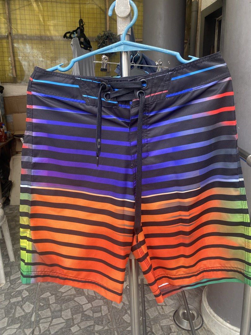 Oakley Board Shorts Multi-Color Stripe Size 30 (Category: Swim Trunks & Board Shorts) located in San Jose del Monte. Submitted by gigjhoe (Listing ID 1465986570, Image 1). Description: - Brand: Oakley - Style: Board shorts with vibrant multi-color stripes (blue, purple, orange, green) on a black base - Size: 30 waist - Features: Lace-up front with black drawstrings, back pocket with button flap - Origin: Made in China.