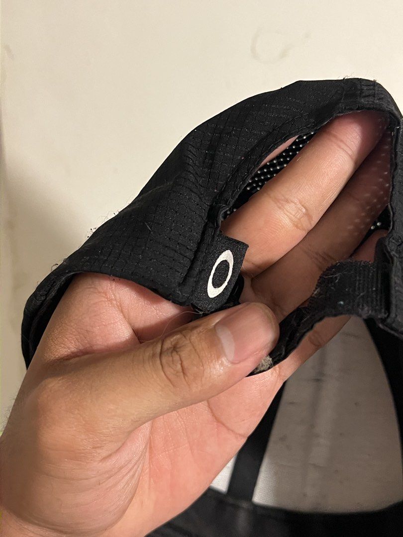Oakley Made For Everywhere Black Cap (Category: Caps & Hats) located in Manila. Submitted by maccabeyo (Listing ID 1466045895, Image 2). Description: - Color: Classic Black - Material: Textured grid fabric for a modern look - Design: Round embroidered patch with Oakley logo and "Made For Everywhere Under The Sun" text - Fit: Adjustable strap closure in the back with a small branded tab - Origin: Made in Vietnam (Since 1975) - Condition: Brand new