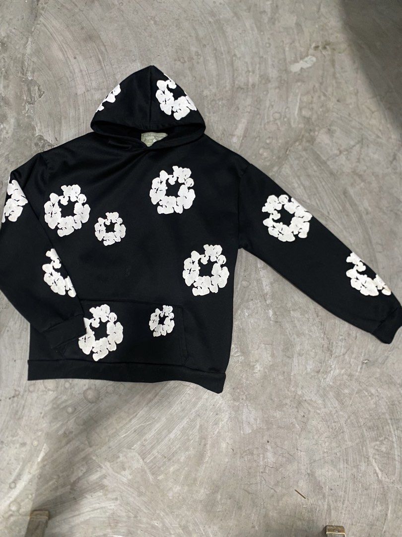 OFFLEGIT Denim Tears (Category: Coats, Jackets and Outerwear) located in Las Pinas. Submitted by 2fly.margiela (Listing ID 1465958185, Image 1). Description: - Color: Black with white floral prints - Design: Floral graphics on front, sleeves, and hood - Features: Front kangaroo pocket - Fit: Standard long sleeve pullover, regular fit - Condition: Clean fabric, well-maintained prints.