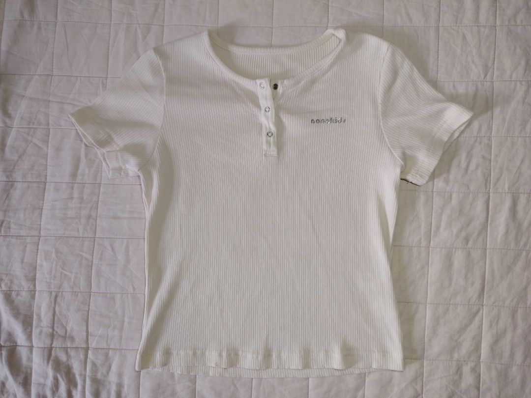 Off-White Ribbed Knit Short Sleeve Top with Snap Buttons (Category: Shirts) located in Tarlac. Submitted by your_finds (Listing ID 1466015905, Image 1). Description: Description: - For kids - Small ang size (pwede sa xs adult) - Off-White ang color - Snap button Condition: 10/10 / Excellent condition Medida size (inch) Bust: 30-32 Length: 17.