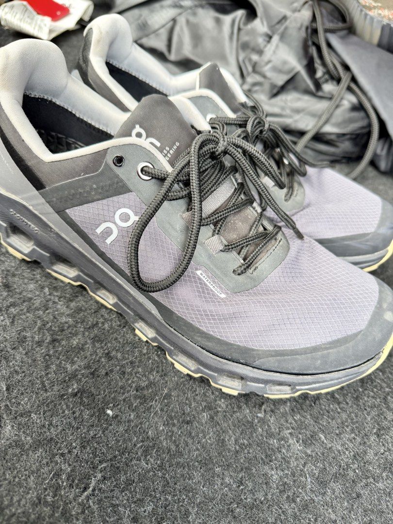 On Cloud Waterproof Sneakers (Category: Sneakers) located in Manila. Submitted by miggy069 (Listing ID 1465984155, Image 1). Description: - Brand: On Cloud - Color: Grey and Black - Type: Waterproof running shoes - Features: Lace-up closure, signature branding, textured mesh upper, chunky cushioned soles - Condition: Insoles show some wear and peeling marks from previous use - Best for: Daily walking, running, or rainy days.