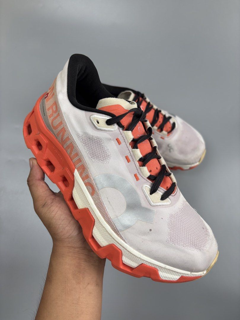 On Running Cloudmonster White Orange Sneakers (Category: Sneakers) located in Cagayan de Oro. Submitted by klebertaco53763 (Listing ID 1466105414, Image 2). Description: - Brand/Model: On Running Cloudmonster - Colorway: White upper with bright orange CloudTec sole and black laces - Condition: Normal signs of wear on soles and upper mesh, plenty of mileage left - Features: Maximum cushioning, large On logo on the side - Best For: Daily runs, walk