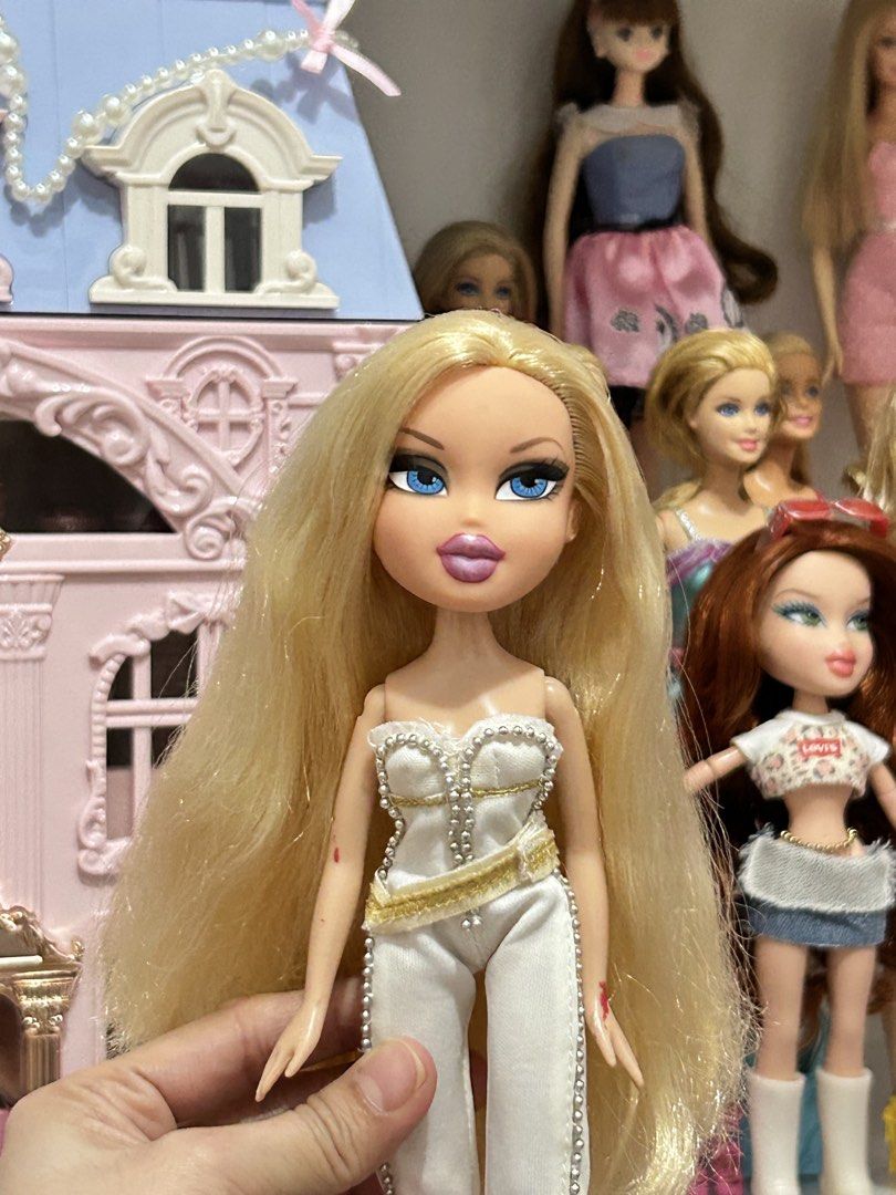 ON SALE Bratz “Designed by” Chloe (Category: Kids Toys) located in Batangas. Submitted by nommi26 (Listing ID 1466145819, Image 2). Description: WYSIWYG - OG/ Authentic Bratz "Designed by" Chloe fashion doll - Striking long blonde hair and vibrant blue eyes - Dressed in her OG chic white and gold jumpsuit accented with stylish beadwork & attached belt - Condition: 7/10 with minor signs of play/wear (small marks on arms visible in photos, also som