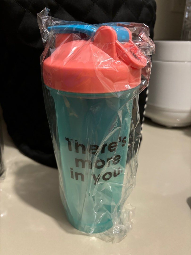 ON Shaker Bottle (Category: Water Bottles & Tumblers) located in Quezon City. Submitted by garagesale2026 (Listing ID 1466132896, Image 1). Description: - Brand new - Still in original plastic packaging - Features a teal body with a coral lid and a blue flip-top.