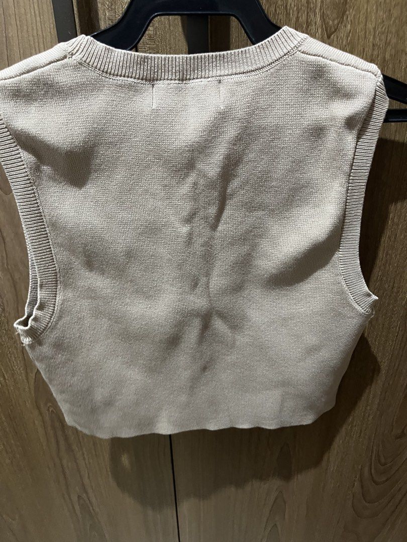ONE-K Beige Knit Tank Top (Category: Sleeveless) located in Quezon City. Submitted by epictiger.c6451a (Listing ID 1465966459, Image 2). Description: - Brand: ONE-K, Design by AS STUDIO - Color: Neutral beige solid - Style: Knit tank top with round neckline and ribbed trim - Condition: Brand new with original hanging tag, no flaws or pulls - Fit: Standard sleeveless, easy to wear alone or layer.
