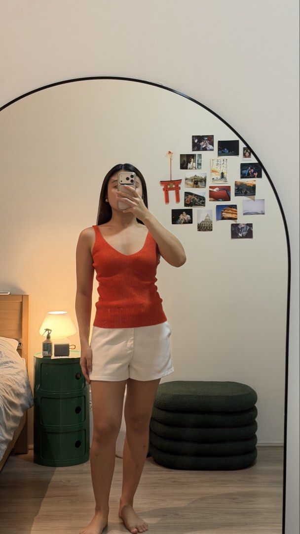 Orange ribbed V-neck tank top (Category: Sleeveless) located in Cebu City. Submitted by wearhousebyhya (Listing ID 1466021220, Image 1). Description: - Color: Bright orange - Material: Stretchy ribbed knit, very comfortable - Design: Deep V-neckline with thick straps - Fit: Fitted silhouette through the torso - Condition: Worn once, washed and ready to wear.