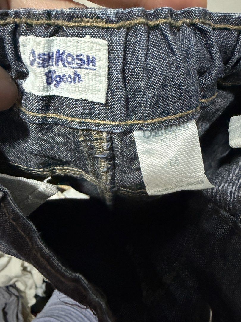 OshKosh B'Gosh Denim Shorts Size M (Category: Shorts) located in Bocaue. Submitted by graceeshoppe (Listing ID 1466142432, Image 2). Description: - Brand: OshKosh B'Gosh - Color: Dark blue denim with contrast stitching - Size: Medium (Tag size M) - Waistband: Elastic at the back with belt loops - Closure & Pockets: Front button closure with functional pockets - Material: Sturdy denim fabric .