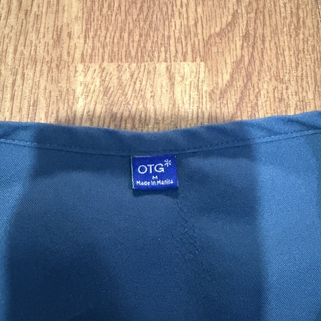 OTG Scrub Suit Top Size M (Category: Activewear) located in Quezon City. Submitted by mssaiira (Listing ID 1466033742, Image 2). Description: TOP ONLY SIZE M -MAY NAME LANG NAKALAGAY KAYO NA PO MAGTANGGAL QC AREA.