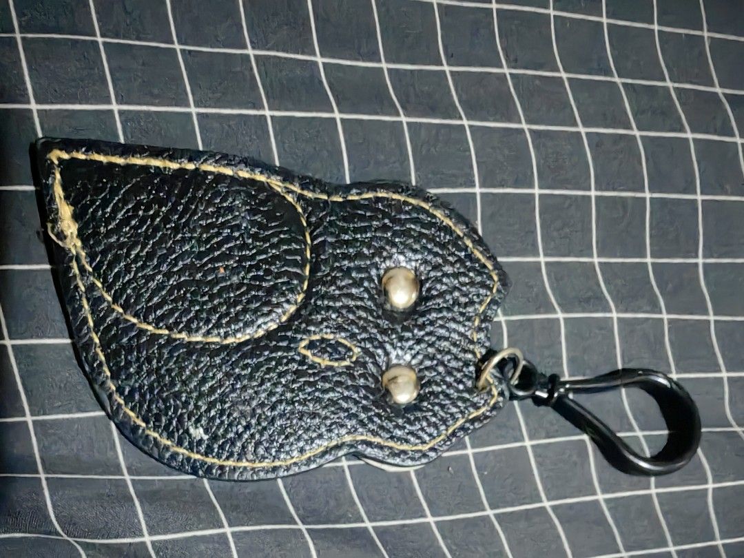 Owl Leather Keychain Bag Charm Black Pink (Category: Charms) located in Davao. Submitted by thefrugalshop (Listing ID 1466087330, Image 2). Description: - Handmade owl shape design in stylish black, pink, and silver leather - Crafted from textured pebble grain leather with striking yellow contrast stitching - Adorable black button eyes on the front - Equipped with a sturdy metal clip for easy hanging on bags, keys, or pouches - Perfect as a gift 