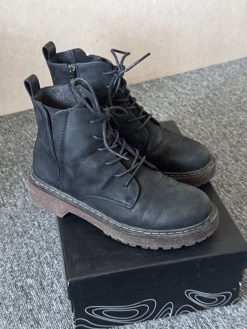 Exull mode Black combat boots with side zippers (Category: Boots) located in Manila. Submitted by sm_wardrobe (Listing ID 1466007674, Image 2). Description: Price negotiable. Feel free to message for proofs/inquiries! 📍Cubao, Quezon City - Color: Classic black with contrasting chunky brown soles - Closure: Front laces and side zippers for easy wear - Features: Convenient heel pull tabs - Packaging: Includes original black box with white graphic 