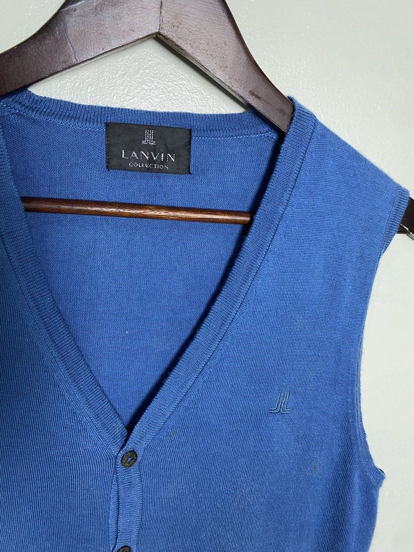 Pan in collection blue knit vest (Category: Others Tops) located in Makati City. Submitted by indaysukaycloset (Listing ID 1466032058, Image 2). Description: LANVIN COLLECTION BLUE KNIT VEST Brand: Lanvin Collection - Luxury Brand (Japan) Size: M on tag - Fits M-L Color: Cornflower Blue / Royal Blue Fabric: 100% Cotton -soft, makapal, presko Made in Japan - 日本製 Details: - V-neck buttondown vest with 2 front pockets - Embroidered Lanvin logo (JL) 