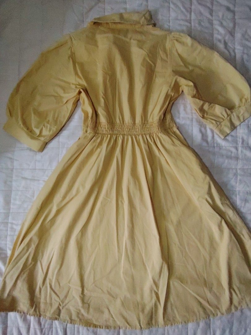 Pastel Yellow Collared Button-Down Shirt Dress (Category: Dresses) located in Tarlac. Submitted by your_finds (Listing ID 1466027290, Image 2). Description: Description: - (Medium on tag) Small to Semi-medium ang size - Pastel Yellow ang color - Working ang buttons - With 2 pockets - Stretchable ang waistline Condition: 9/10 / Very good condition Issue: Nag cracked ang isang button Medida size (inch) Bust: 33-35 Sleeve length: 15 Waist: 27-33 Len