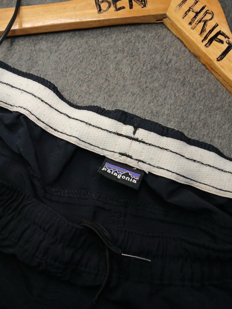 Patagonia Black Shorts womens (Category: Shorts) located in Caloocan City. Submitted by benthriftshp (Listing ID 1466136154, Image 3). Description: - Color: Black - Brand: Patagonia - Style: Vintage woven logo tags on hem and inner waistband - Fit: Elastic waistband with adjustable drawstring - Fabric: Lightweight and breathable - Measurements: ~14 inches across flat waist - Condition: Clean, no tears or stains 29-33×13 dimes 400+sf.