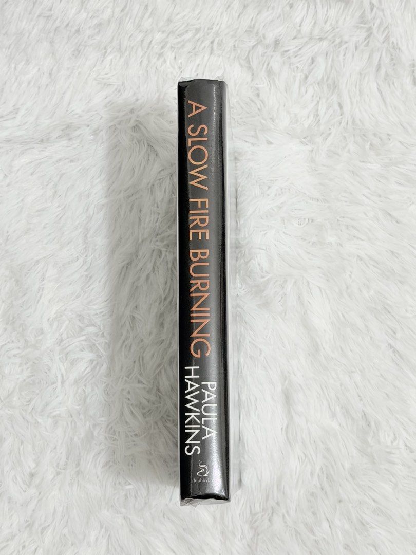 PAULA HAWKNS - A SLOW FIRE BURNING Hardcover - PRELOVED (Category: Storybooks) located in Malolos. Submitted by jnrreadershavenbooks (Listing ID 1466023523, Image 3). Description: ☑SECONDHAND HARDCOVER BOOK (ORIGINAL AND AUTHENTIC) FOR SALE!!! ✅Writer: Paula Hawkins ✅Title: A Slow Fire Burning ✅Mode of Payment: Gcash/BPI/GoTyme ✅Delivery via J&T Express (or you may book Lalamove for same day delivery). ✅Book Information: ISBN-13:9780857524447 ISB