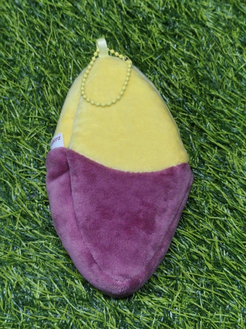 Peripera Sweet Potato Plush Pouch Bag Charm (Category: Plushies & Soft Toys) located in Paranaque City. Submitted by furugiyafinds (Listing ID 1466103314, Image 2). Description: - Authentic Peripera sweet potato plush pouch - Features a cute embroidered smiley face on the yellow top and roasted yam skin design on the purple bottom - Made with ultra-soft material - Equipped with a yellow ball chain for easy hanging on bags or keys - Comes with ori