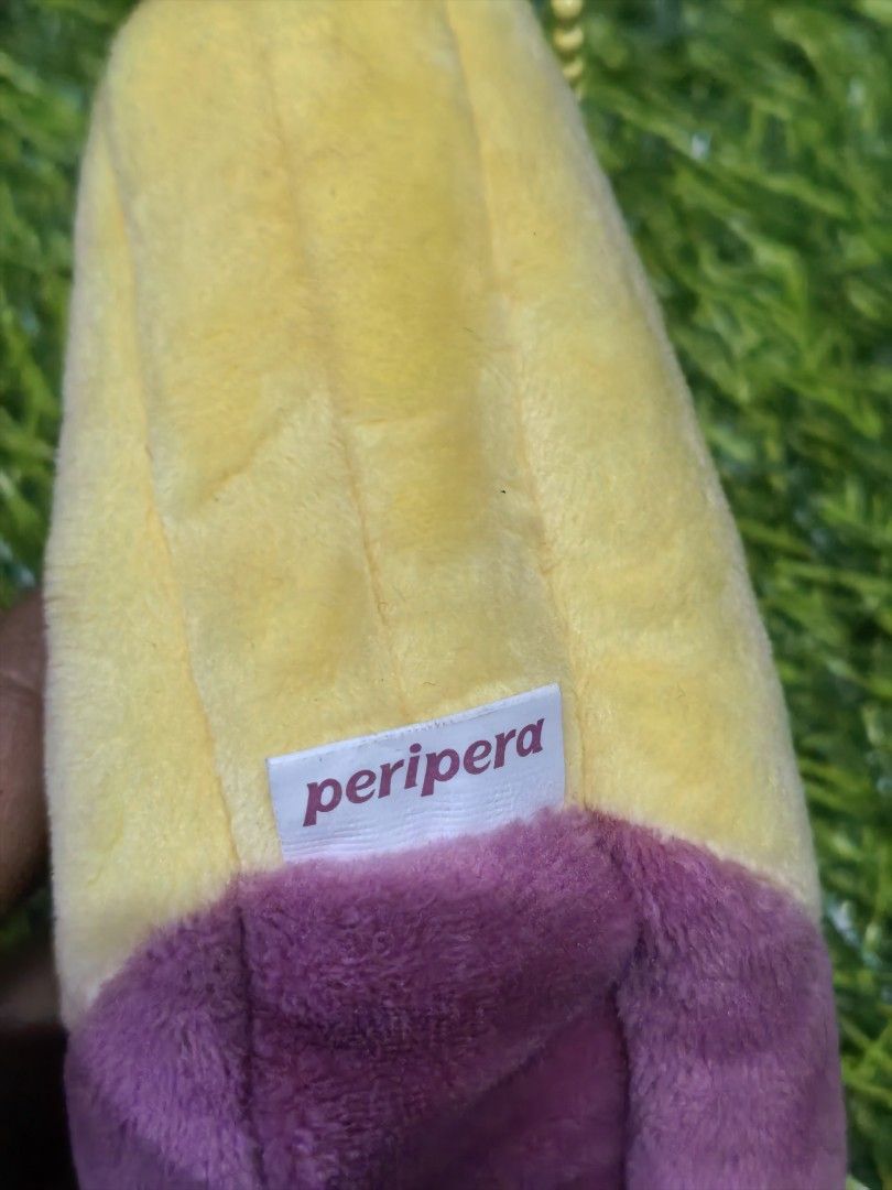 Peripera Sweet Potato Plush Pouch Bag Charm (Category: Plushies & Soft Toys) located in Paranaque City. Submitted by furugiyafinds (Listing ID 1466103314, Image 3). Description: - Authentic Peripera sweet potato plush pouch - Features a cute embroidered smiley face on the yellow top and roasted yam skin design on the purple bottom - Made with ultra-soft material - Equipped with a yellow ball chain for easy hanging on bags or keys - Comes with ori