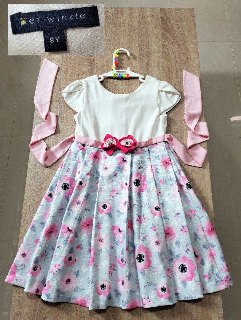 Periwinkle Floral Dress Size 8Y (Category: Babies & Kids Fashion) located in Angeles City. Submitted by heartfaveph. (Listing ID 1466070537, Image 1). Description: - Brand: Periwinkle - Size: 8 years - Design: White short-sleeve top paired with a light blue floral skirt - Details: Cute pink flower decorations on the waist sash and matching side ties - Occasion: Ideal for parties, weddings, and special events - Condition: Excellent pre-loved condi