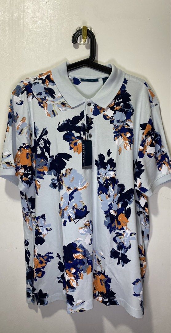 Perry Ellis Men's Polo Shirt Bundle Size L (Category: Tshirts & Polo Shirts ) located in Taguig. Submitted by markaisie (Listing ID 1466053829, Image 3). Description: - Brand: Perry Ellis - Quantity: 2 polo shirts - Size: Large - Styles/Colors: Grey patterned (Chiseled Stone) and Blue/Orange floral (Country Air) - Condition: Brand new with original tags attached - Fabric: Ultra-soft touch construction for maximum comfort.
