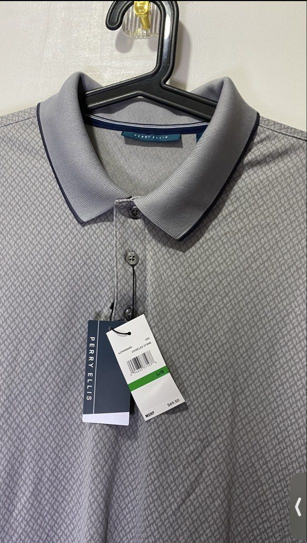 Perry Ellis Men's Polo Shirt Bundle Size L (Category: Tshirts & Polo Shirts ) located in Taguig. Submitted by markaisie (Listing ID 1466053829, Image 1). Description: - Brand: Perry Ellis - Quantity: 2 polo shirts - Size: Large - Styles/Colors: Grey patterned (Chiseled Stone) and Blue/Orange floral (Country Air) - Condition: Brand new with original tags attached - Fabric: Ultra-soft touch construction for maximum comfort.