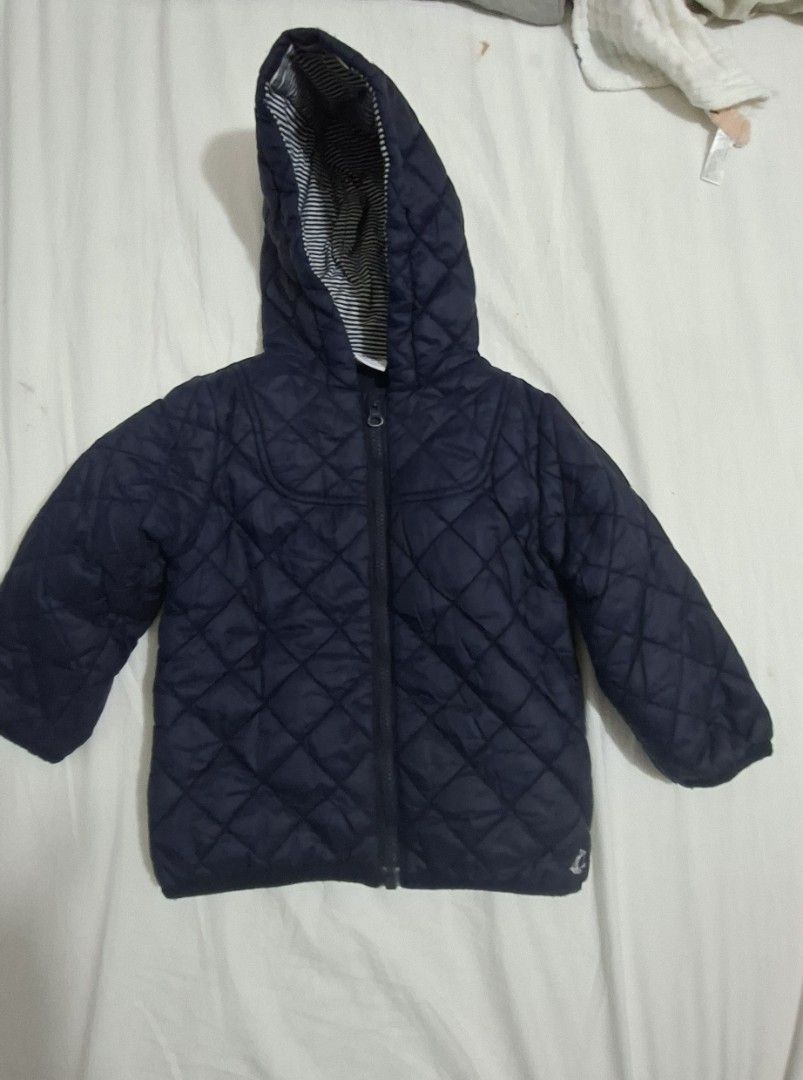 Petit Bateau Navy Quilted Puffer Hooded Jacket (Category: Babies & Kids Fashion) located in Taguig. Submitted by wolffangs (Listing ID 1466004987, Image 2). Description: - Brand: Petit Bateau (bought in Japan) - Size: 18months / 81cm - Color/Design: Navy with classic diamond outer pattern - Lining: Warm navy fleece inside the body - Hood: Attached hood with cute striped inner fabric - Closure: Full front zip.