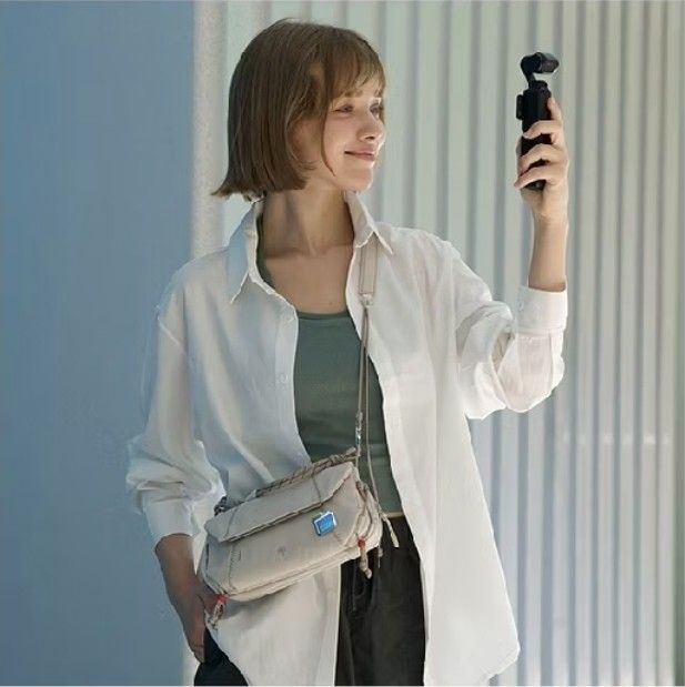 PGYTECH OneGo Pocket Sling White (Category: Cross-body Bags) located in Makati City. Submitted by jeanneguerrero (Listing ID 1465994736, Image 2). Description: - Brand new with tags still attached - Color: Clean minimalist white - Compact crossbody bag for daily essentials and small gear - Lightweight material with a sleek aesthetic - Features an adjustable strap and unique rope handle detail - RFS: too small for my stuff - Bought for 2+k, sellin