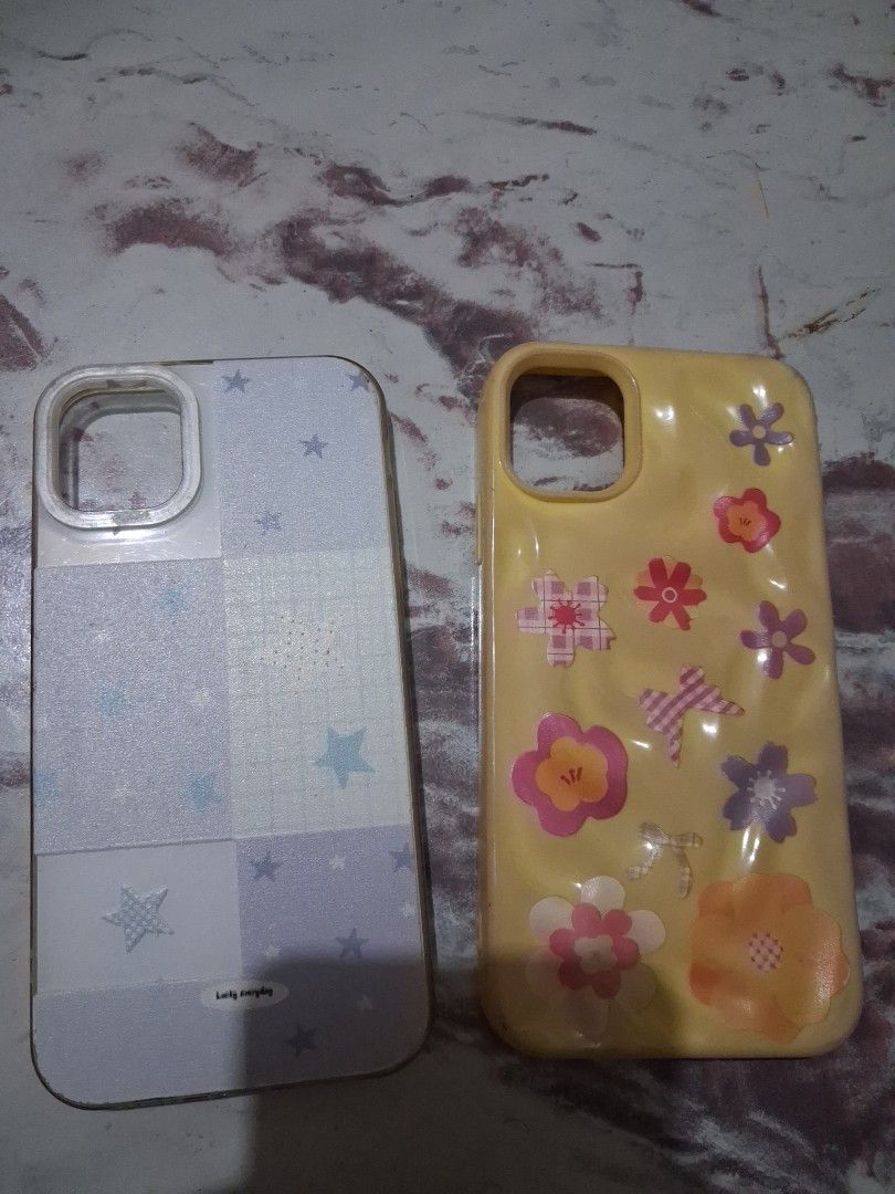 Phone case ip11 (set) (Category: Cases & Sleeves) located in Manila. Submitted by meoww144 (Listing ID 1466078383, Image 1). Description: - Set of 2 phone cases compatible with iPhone 11 - Design 1: Yellow wavy case with cute colorful flowers - Design 2: Blue and white checkered pattern with star prints and 'Lucky everyday' label - Layered condition: 4 - Perfect for daily use and easy styling change.