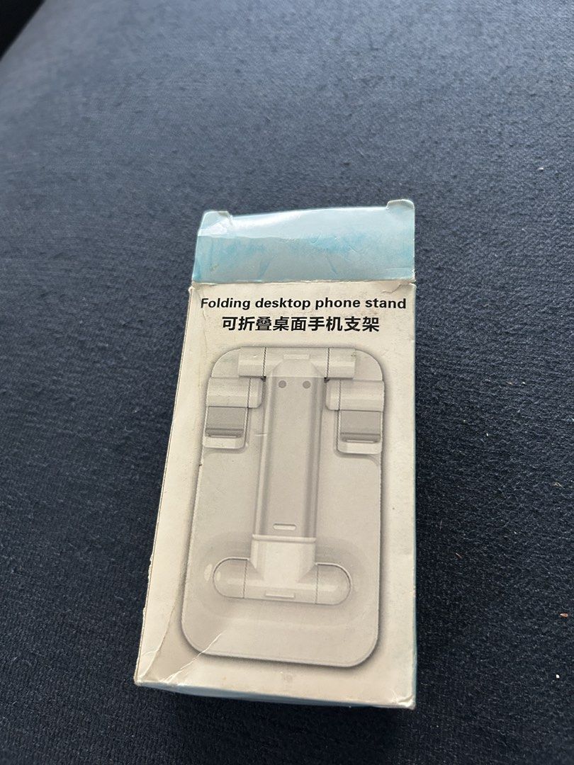 Phone stand (Category: Mounts & Holders) located in Singapore. Submitted by wx.onexmedia (Listing ID 1466145607, Image 2). Description: Deliver only.