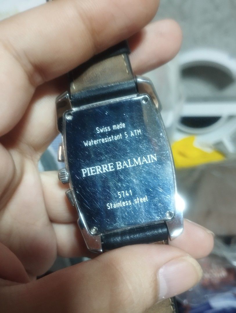 Pierre Balmain Arcade Chrono Swiss Made Chronograph Watch (Category: Luxury Watches) located in Pasig City. Submitted by nyjah1997 (Listing ID 1466009076, Image 3). Description: - Brand: Pierre Balmain - Movement: Swiss-made chronograph - Case: Tonneau shape with stainless steel back (Numbered: 5741) - Dial: Black textured dial with sub-dials and date window at 6 o'clock - Strap: Genuine black leather - Details: Crown and pushers on the right sid