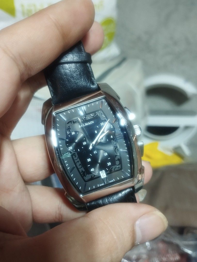 Pierre Balmain Arcade Chrono Swiss Made Chronograph Watch (Category: Luxury Watches) located in Pasig City. Submitted by nyjah1997 (Listing ID 1466009076, Image 2). Description: - Brand: Pierre Balmain - Movement: Swiss-made chronograph - Case: Tonneau shape with stainless steel back (Numbered: 5741) - Dial: Black textured dial with sub-dials and date window at 6 o'clock - Strap: Genuine black leather - Details: Crown and pushers on the right sid