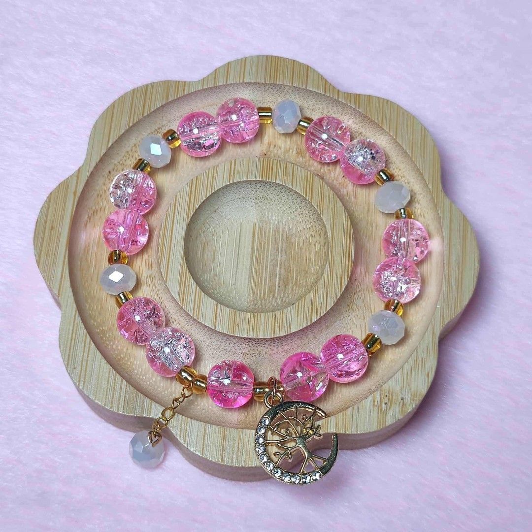 Pink Beaded Bracelet with Moon and Tree Charm (Category: Bracelets) located in Taguig. Submitted by fits.for.less (Listing ID 1466061294, Image 1). Description: 60 pesos MOP: Gcash MOD: lalamove/grab, pick-up if malapit lang.