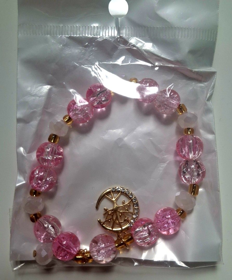 Pink Beaded Bracelet with Moon and Tree Charm (Category: Bracelets) located in Taguig. Submitted by fits.for.less (Listing ID 1466061294, Image 2). Description: 60 pesos MOP: Gcash MOD: lalamove/grab, pick-up if malapit lang.