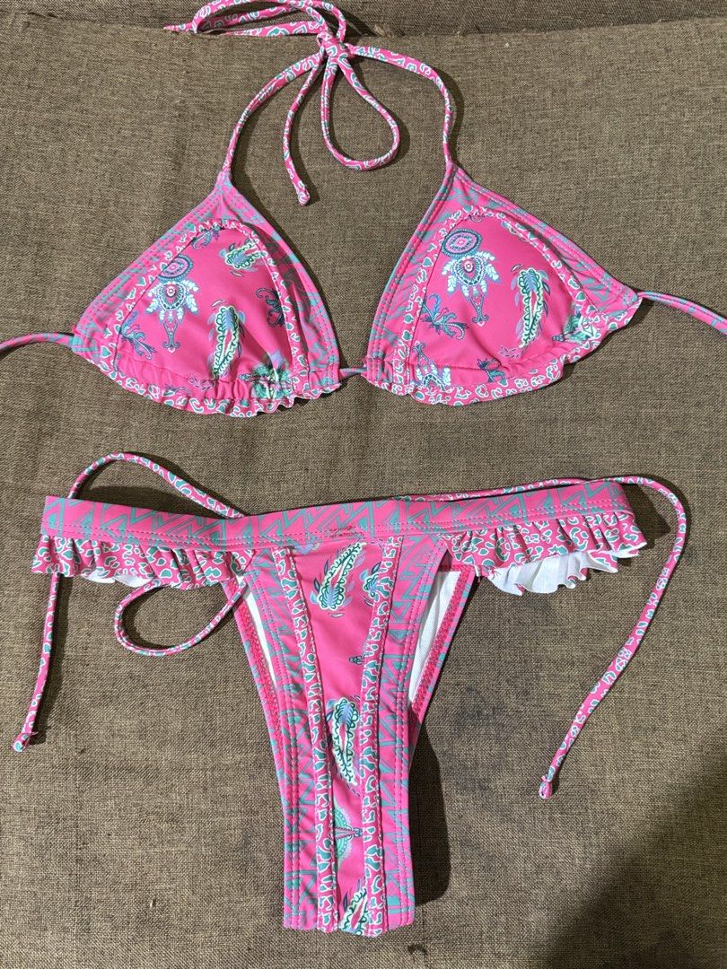 Pink bikini set xs-s size. Never used (Category: Bikinis & Swimsuits) located in Taguig. Submitted by jdrysssss (Listing ID 1466039025, Image 1). Description: - Vibrant pink and turquoise paisley print - Size: Extra Small (XS) - Small (S) - Material: 82% polyester, 18% elastane - Triangle top with halter ties and playful ruffles - Matching bottoms - Includes removable padding slots .