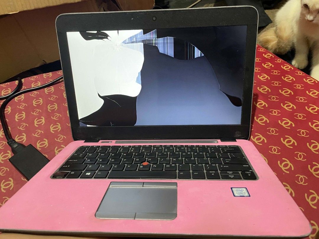 Pink HP Laptop Intel Core i5 with Accessories Bundle (Category: Laptops & Notebooks) located in Quezon City. Submitted by ricoav (Listing ID 1466152618, Image 3). Description: - HP Laptop with Intel Core i5 processor - Customized with a stylish pink skin wrap - Condition: Screen is cracked and damaged (Selling for parts/repair) - Complete pink aesthetic bundle including matching wireless mouse, laptop sleeve, and laptop stand - Extras: Phone hold