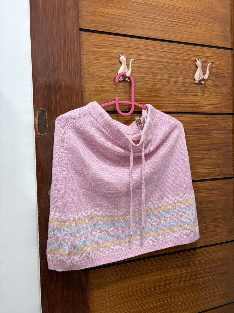 Pink knitted skirt (Category: Coats, Jackets and Outerwear) located in Guiguinto. Submitted by twinklingthreads (Listing ID 1466052868, Image 1). Description: - Adorable pink knit poncho - Features a drawstring at the neck for adjustable fit - Beautiful colorful Fair Isle pattern along the hem - Ideal for layering over your favorite tops - Perfect for staying cozy during cooler weather.