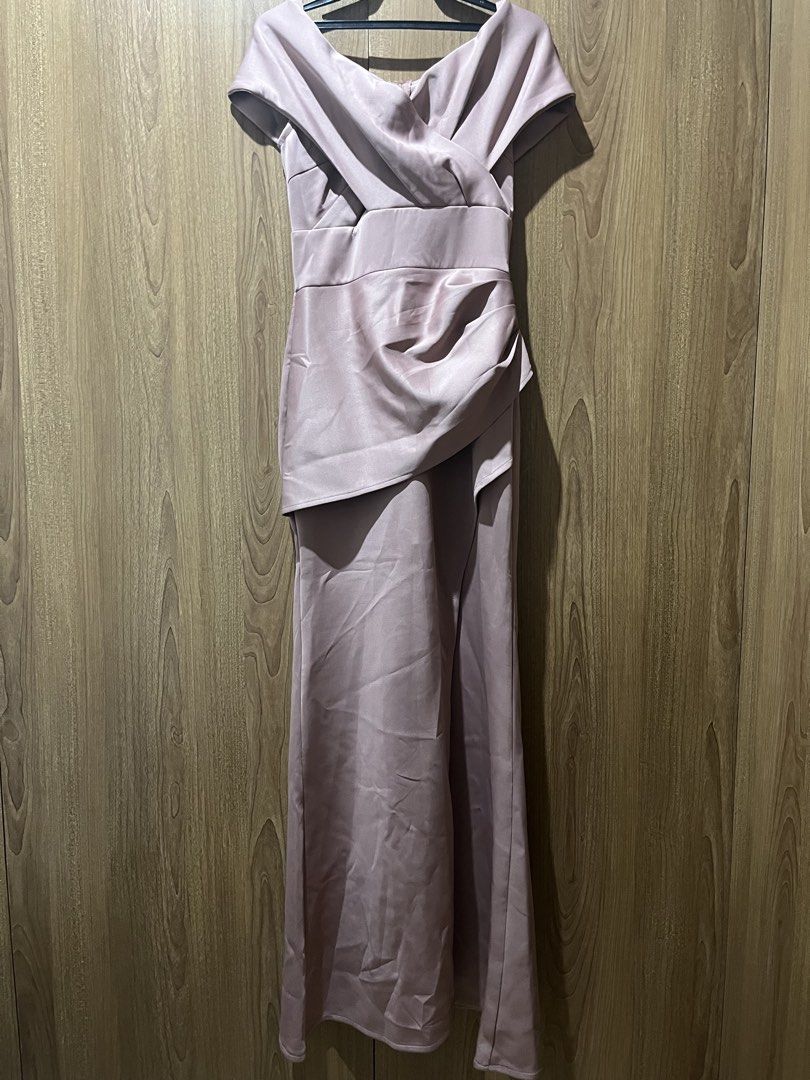 Pink Off-Shoulder Formal Evening Maxi Dress (Category: Evening dresses & gowns) located in Quezon City. Submitted by epictiger.c6451a (Listing ID 1465966721, Image 1). Description: - Color: Dusty pink - Style: Off-shoulder crossover neckline, fitted waist with side draping, floor-length maxi skirt - Material: Smooth satin-like fabric with back zip closure - Condition: Worn once, dry cleaned, no stains or tears.