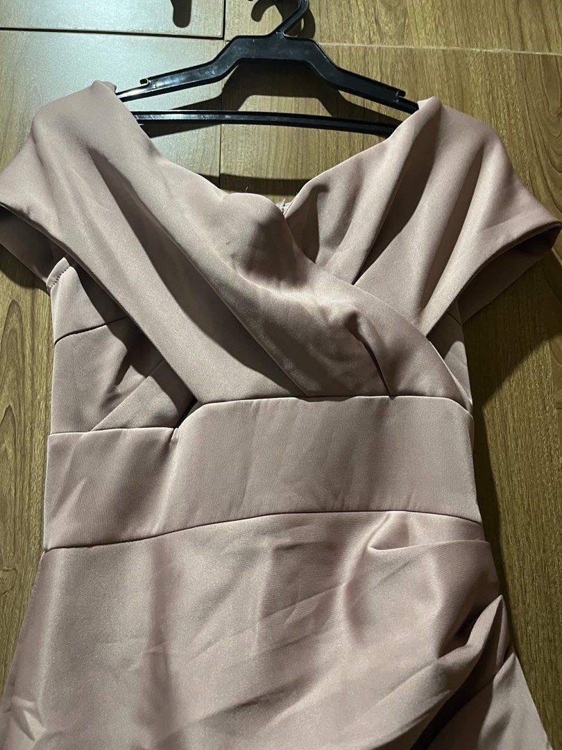 Pink Off-Shoulder Formal Evening Maxi Dress (Category: Evening dresses & gowns) located in Quezon City. Submitted by epictiger.c6451a (Listing ID 1465966721, Image 2). Description: - Color: Dusty pink - Style: Off-shoulder crossover neckline, fitted waist with side draping, floor-length maxi skirt - Material: Smooth satin-like fabric with back zip closure - Condition: Worn once, dry cleaned, no stains or tears.