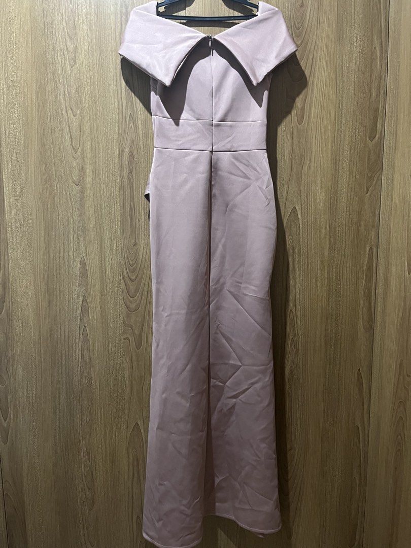 Pink Off-Shoulder Formal Evening Maxi Dress (Category: Evening dresses & gowns) located in Quezon City. Submitted by epictiger.c6451a (Listing ID 1465966721, Image 3). Description: - Color: Dusty pink - Style: Off-shoulder crossover neckline, fitted waist with side draping, floor-length maxi skirt - Material: Smooth satin-like fabric with back zip closure - Condition: Worn once, dry cleaned, no stains or tears.