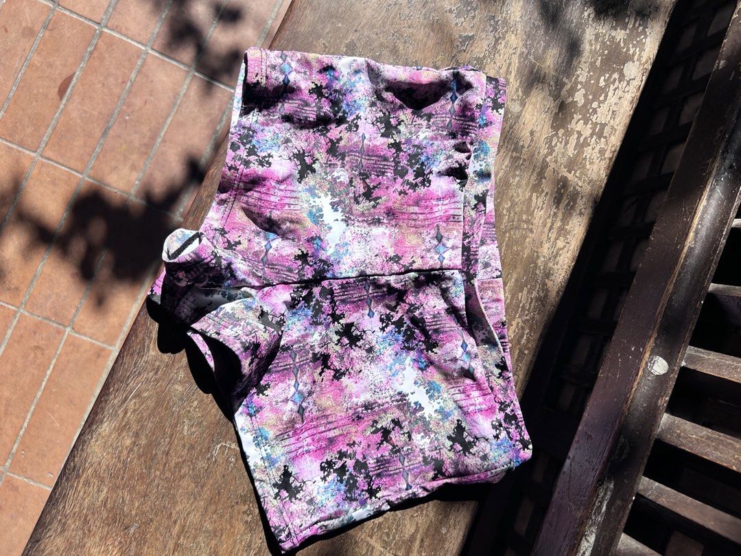 Pink patterned athletic shorts activewear workout bottom (Category: Activewear) located in Makati City. Submitted by hzsans92 (Listing ID 1466102335, Image 1). Description: - Vibrant pink athletic shorts with a multi-color abstract print (black, blue, and white accents) - Stretchy, high-performance fabric ideal for workouts and running - Comfortable elastic waistband for a secure fit - Short inseam style for maximum mobility - Condition: Excellen