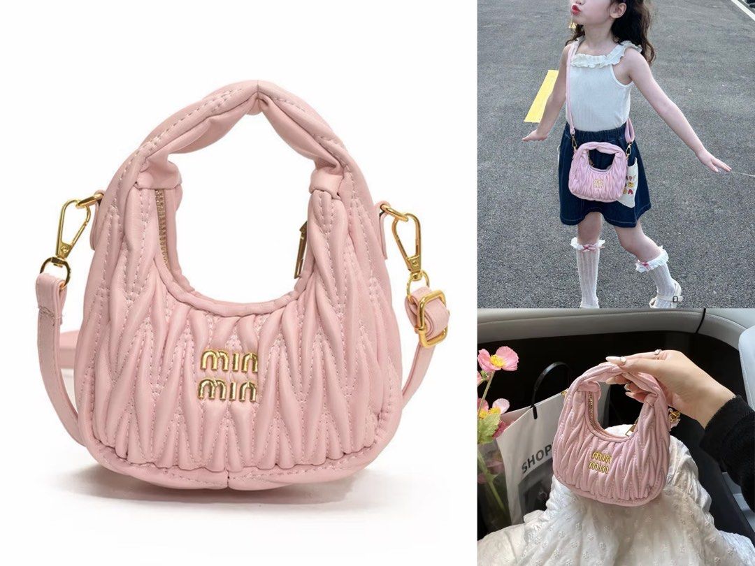 Pink Quilted Leather Mini Hobo Bag (Category: Luxury Bags & Wallets) located in Orani. Submitted by dejaniuph (Listing ID 1465968129, Image 1). Description: - Brand: Miu Miu - Material: Pink quilted leather with gold-tone hardware - Features: Iconic gold metal lettering logo on the front - Handle & Closure: Unique twisted top handle design and secure zip closure - Strap: Includes a matching adjustable shoulder strap with gold clasps - Versatility