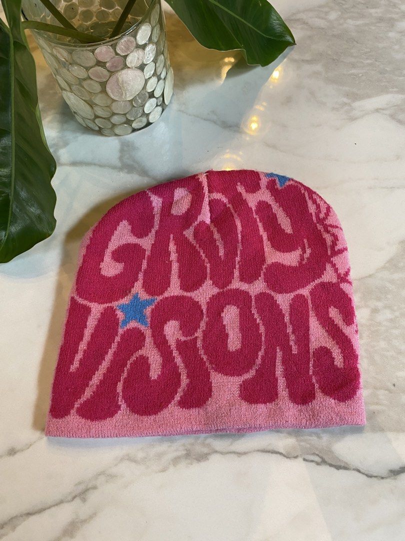 Pink y2k bonnet (Category: Hats & Beanies) located in Makati City. Submitted by indaysukaycloset (Listing ID 1465979488, Image 1). Description: PINK Y2K BONNET / BEANIE Design: "GIRLS VISIONS" - Retro Bubble Letters Color: Light Pink / Hot Pink / with blue star & spider web print Details: - Thin knit beanie, soft & stretchy - no cuff style - Front: GIRLS VISIONS in big puffy retro font - Side: Spider web graphic - Y2K / Harajuku style - Free size