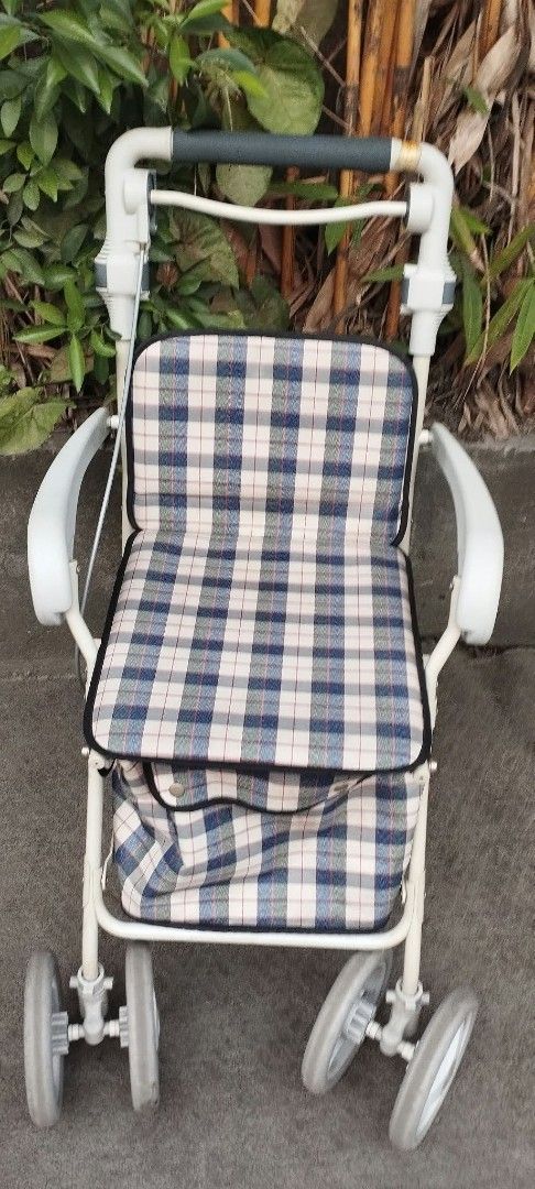 Plaid Rollator Walker with Seat and Storage Bag (Category: Wheelchairs) located in Manila. Submitted by benjie.benjie3 (Listing ID 1466081853, Image 1). Description: Folding Adult walker for seniors from Japan NO to COD NO swapping Estimate size H= 33 1/2 inches L= 25 Inches W=181/2 inches Capacity= single Material = metal , rubber, plastic Made in Japan 2nd hand with scratch No warranty If there's Damage or Issues they can be seen in the last pi